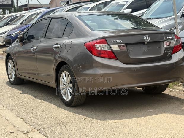 Honda Civic EX-L 2dr Coupe (1.8L 4cyl CVT) 2014 Gold