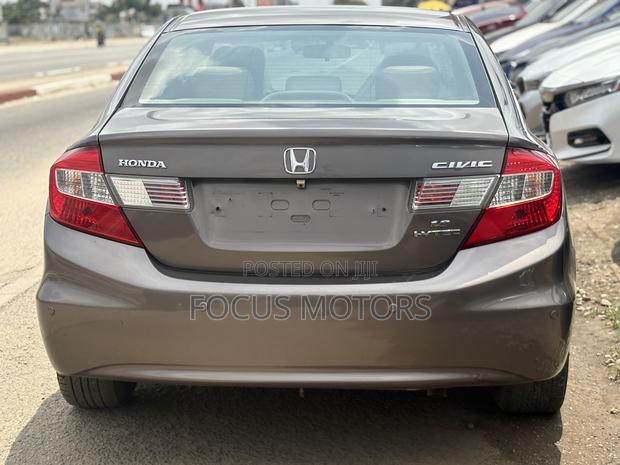 Honda Civic EX-L 2dr Coupe (1.8L 4cyl CVT) 2014 Gold