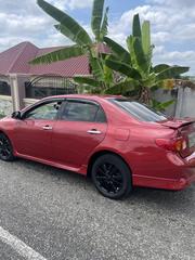 Toyota Corolla Base 4dr Sedan (1.8L 4cyl 5M) 2010 Red for sale