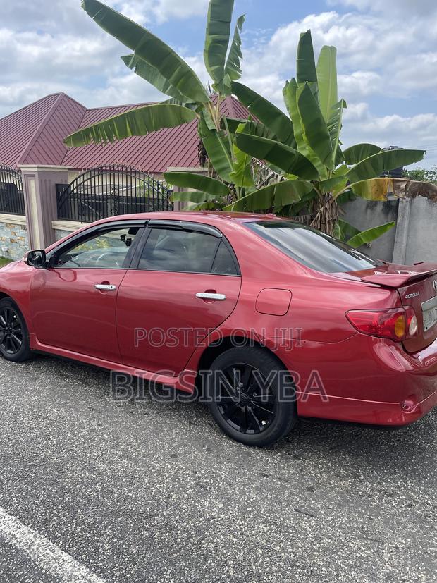 Toyota Corolla Base 4dr Sedan (1.8L 4cyl 5M) 2010 Red
