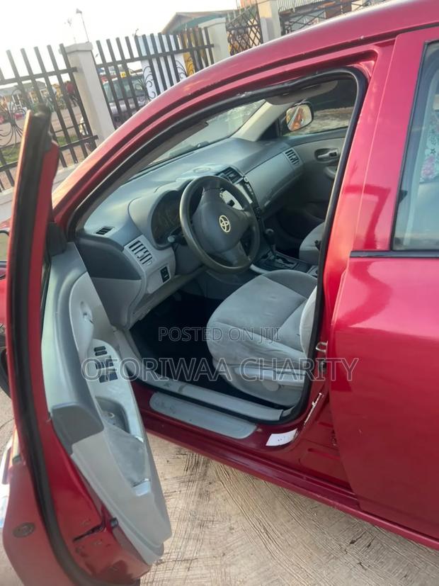 Toyota Corolla Base 4dr Sedan (1.8L 4cyl 5M) 2010 Red
